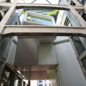 Building exterior covered with tensioned fabric